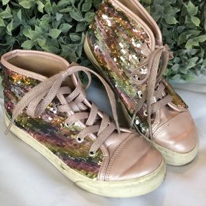 Kids place tennis shoes